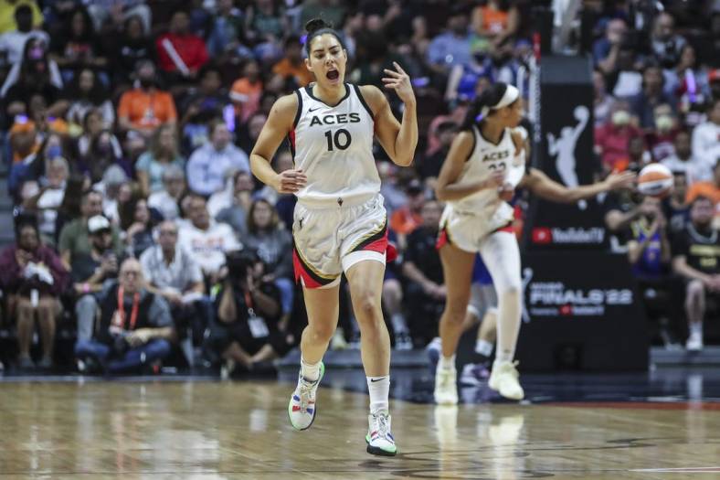 Sep 18, 2022; Uncasville, Connecticut, USA; Las Vegas Aces guard Kelsey Plum (10) celebrates after making a three point shot in the first half during game four of the 2022 WNBA Finals against the Connecticut Sun at Mohegan Sun Arena. Mandatory Credit: Wendell Cruz-USA TODAY Sports