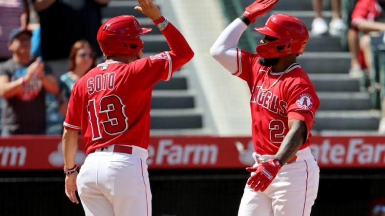 Sep 18, 2022; Anaheim, California, USA;  Los Angeles Angels third baseman Luis Rengifo (2) celebrates with shortstop Livan Soto (13) after hitting a second home run of the game during the third inning against the Seattle Mariners at Angel Stadium. Mandatory Credit: Kiyoshi Mio-USA TODAY Sports