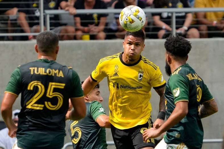 Sep 18, 2022; Columbus, Ohio, USA; Columbus Crew forward Cucho Hernandez (9) heads a ball over Portland Timbers midfielder Eryk Williamson (19) during the first half of the MLS game at Lower.com Field. Mandatory Credit: Adam Cairns-The Columbus Dispatch

Mls Portland Timbers At Columbus Crew