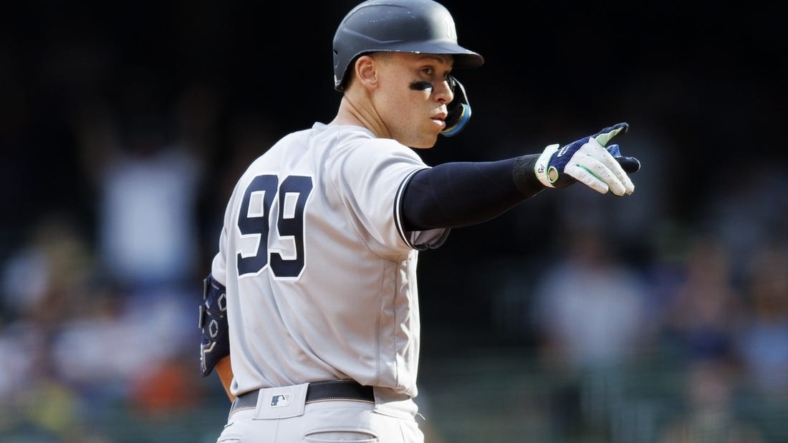 Sep 18, 2022; Milwaukee, Wisconsin, USA;  New York Yankees center fielder Aaron Judge (99) gestures after hitting an RBI double during the ninth inning against the Milwaukee Brewers at American Family Field. Mandatory Credit: Jeff Hanisch-USA TODAY Sports