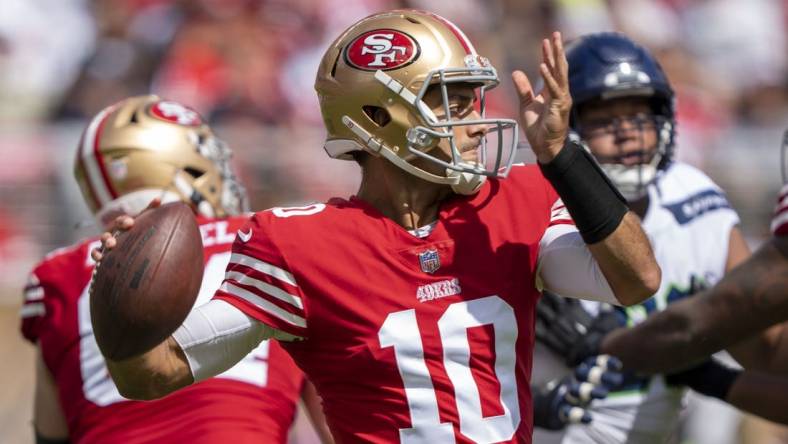 September 18, 2022; Santa Clara, California, USA; San Francisco 49ers quarterback Jimmy Garoppolo (10) passes the football against the Seattle Seahawks during the second quarter at Levi's Stadium. Mandatory Credit: Kyle Terada-USA TODAY Sports