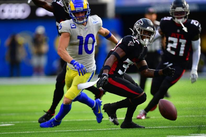Sep 18, 2022; Inglewood, California, USA; Atlanta Falcons cornerback Dee Alford (37) runs after the ball on a fumble by Los Angeles Rams wide receiver Cooper Kupp (10) during the second half at SoFi Stadium. Mandatory Credit: Gary A. Vasquez-USA TODAY Sports