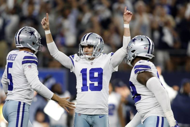 Sep 18, 2022; Arlington, Texas, USA;  Dallas Cowboys place kicker Brett Maher (19) and punter Bryan Anger (5) celebrate the game winning field goal at the end of the game against the Cincinnati Bengals at AT&T Stadium. Mandatory Credit: Tim Heitman-USA TODAY Sports