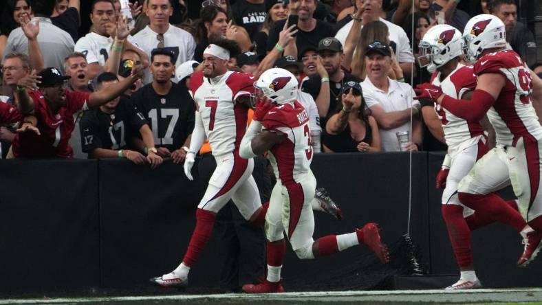 Sep 18, 2022; Paradise, Nevada, USA; Arizona Cardinals cornerback Byron Murphy Jr. (7) celebrates after scoring on a 59-yard fumble recovery in overtime against the Las Vegas Raiders at Allegiant Stadium. Mandatory Credit: Kirby Lee-USA TODAY Sports