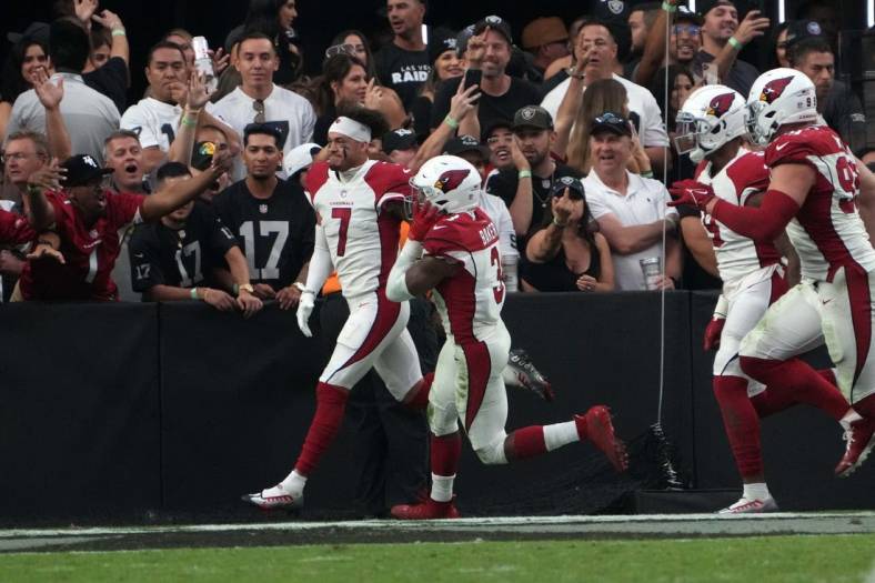 Sep 18, 2022; Paradise, Nevada, USA; Arizona Cardinals cornerback Byron Murphy Jr. (7) celebrates after scoring on a 59-yard fumble recovery in overtime against the Las Vegas Raiders at Allegiant Stadium. Mandatory Credit: Kirby Lee-USA TODAY Sports