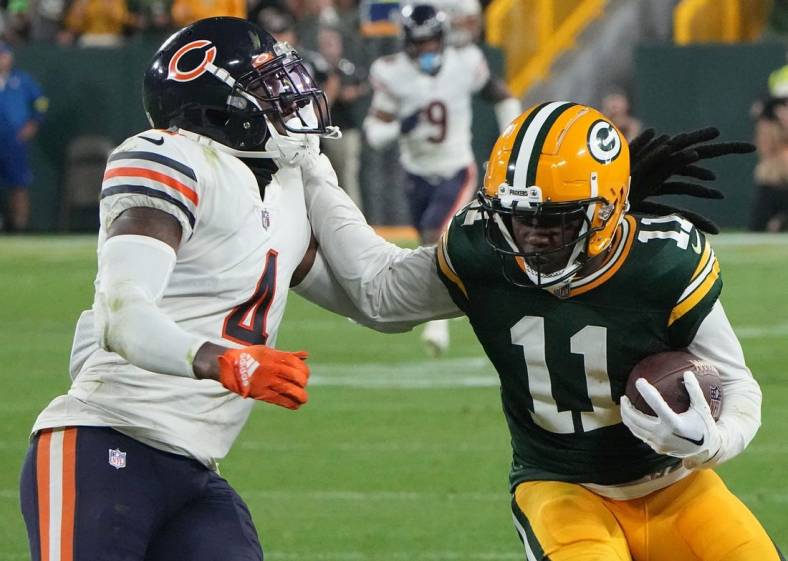 Green Bay Packers wide receiver Sammy Watkins (11) stiff arms Chicago Bears safety Eddie Jackson (4) while picking  up 14 yards on a reception during the fourth quarter of their game Sunday, September 18, 2022 at Lambeau Field in Green Bay, Wis. The Green Bay Packers beat the Chicago Bears 27-10.

Packers18 13
