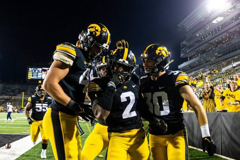 Iowa defensive back Terry Roberts, center, celebrates with teammates Max Llewellyn, left, and Quinn Schulte after intercepting during a NCAA football game against Nevada, Sunday, Sept. 18, 2022, at Kinnick Stadium in Iowa City, Iowa. The play was overturned due to a penalty against Iowa.

220917 Nevada Iowa Fb 068 Jpg
