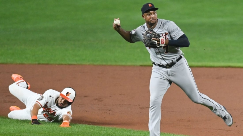 Sep 19, 2022; Baltimore, Maryland, USA; Detroit Tigers second baseman Jonathan Schoop (7) throws to first base after tagging out Baltimore Orioles right fielder Anthony Santander (25) in the seventh inning  at Oriole Park at Camden Yards. Mandatory Credit: Tommy Gilligan-USA TODAY Sports