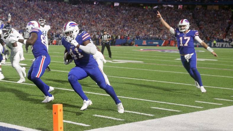 Bills fullback Reggie Gilliam his cheered to the end zone by Josh Allen n a 41-7 win over Tennessee.

Ag3i1365