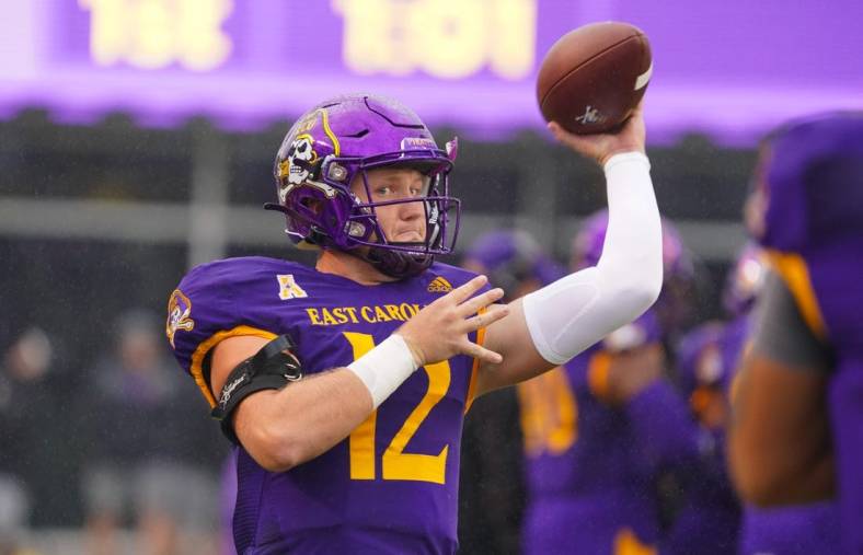 Sep 10, 2022; Greenville, North Carolina, USA;  East Carolina Pirates quarterback Holton Ahlers (12) throws the ball against the Old Dominion Monarchs before the game at Dowdy-Ficklen Stadium. Mandatory Credit: James Guillory-USA TODAY Sports