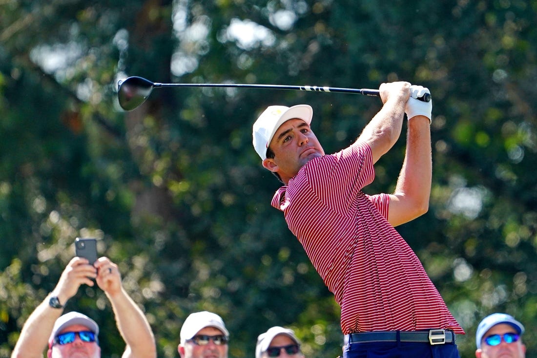 Sep 20, 2022; Charlotte, North Carolina, USA; Team USA golfer Scottie Scheffler plays his shot from the 15th tee during a practice day for the Presidents Cup golf tournament at Quail Hollow Club. Mandatory Credit: Peter Casey-USA TODAY Sports