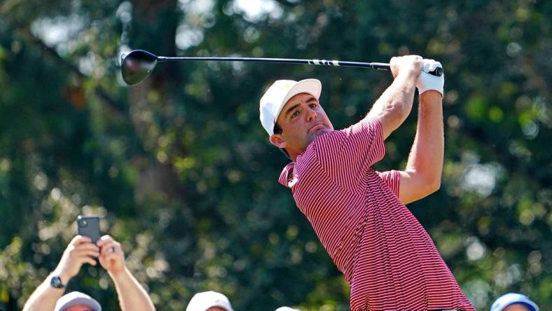 Sep 20, 2022; Charlotte, North Carolina, USA; Team USA golfer Scottie Scheffler plays his shot from the 15th tee during a practice day for the Presidents Cup golf tournament at Quail Hollow Club. Mandatory Credit: Peter Casey-USA TODAY Sports