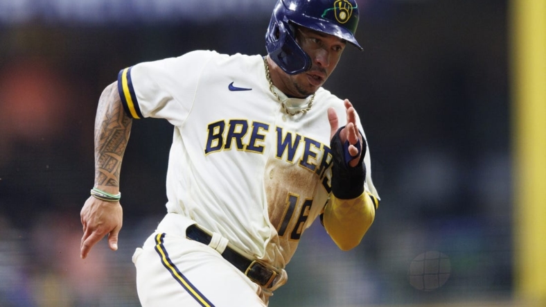 Sep 20, 2022; Milwaukee, Wisconsin, USA;  Milwaukee Brewers second baseman Kolten Wong (16) rounds third base before scoring a run during the second inning against the New York Mets at American Family Field. Mandatory Credit: Jeff Hanisch-USA TODAY Sports
