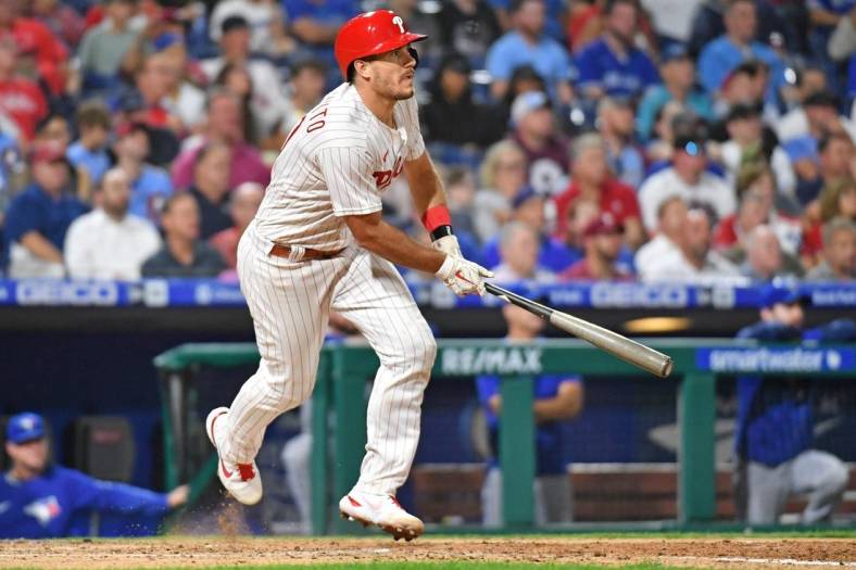 Sep 20, 2022; Philadelphia, Pennsylvania, USA; Philadelphia Phillies catcher J.T. Realmuto (10) hits an RBI single against the Toronto Blue Jays during the fifth inning at Citizens Bank Park. Mandatory Credit: Eric Hartline-USA TODAY Sports