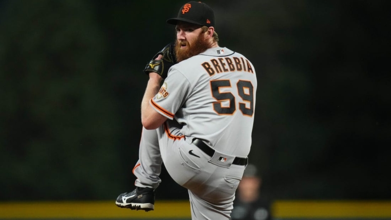 Sep 20, 2022; Denver, Colorado, USA; San Francisco Giants relief pitcher John Brebbia (59) pitches in the first inning against the Colorado Rockies at Coors Field. Mandatory Credit: Ron Chenoy-USA TODAY Sports