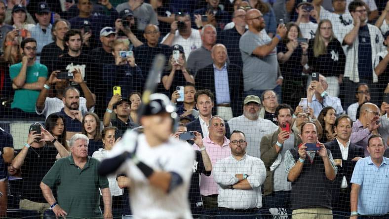 Sep 20, 2022; Bronx, New York, USA; Fans watch as New York Yankees right fielder Aaron Judge (99) bats against the Pittsburgh Pirates during the sixth inning at Yankee Stadium. Mandatory Credit: Brad Penner-USA TODAY Sports