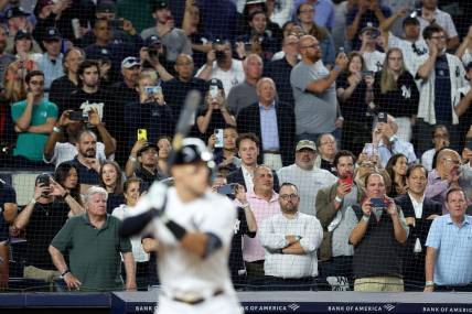 Sep 20, 2022; Bronx, New York, USA; Fans watch as New York Yankees right fielder Aaron Judge (99) bats against the Pittsburgh Pirates during the sixth inning at Yankee Stadium. Mandatory Credit: Brad Penner-USA TODAY Sports