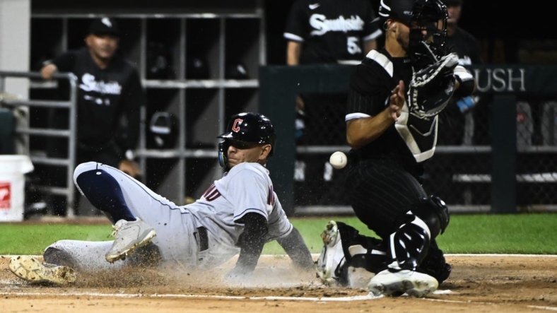 Sep 20, 2022; Chicago, Illinois, USA;  Cleveland Guardians second baseman Andres Gimenez (0) scores past Chicago White Sox catcher Seby Zavala (44) during the second inning at Guaranteed Rate Field. Mandatory Credit: Matt Marton-USA TODAY Sports