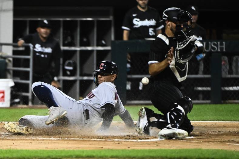 Sep 20, 2022; Chicago, Illinois, USA;  Cleveland Guardians second baseman Andres Gimenez (0) scores past Chicago White Sox catcher Seby Zavala (44) during the second inning at Guaranteed Rate Field. Mandatory Credit: Matt Marton-USA TODAY Sports