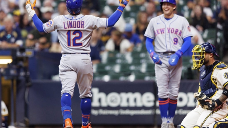 Sep 20, 2022; Milwaukee, Wisconsin, USA;  New York Mets shortstop Francisco Lindor (12) celebrates after hitting a grand slam home run during the seventh inning against the Milwaukee Brewers at American Family Field. Mandatory Credit: Jeff Hanisch-USA TODAY Sports