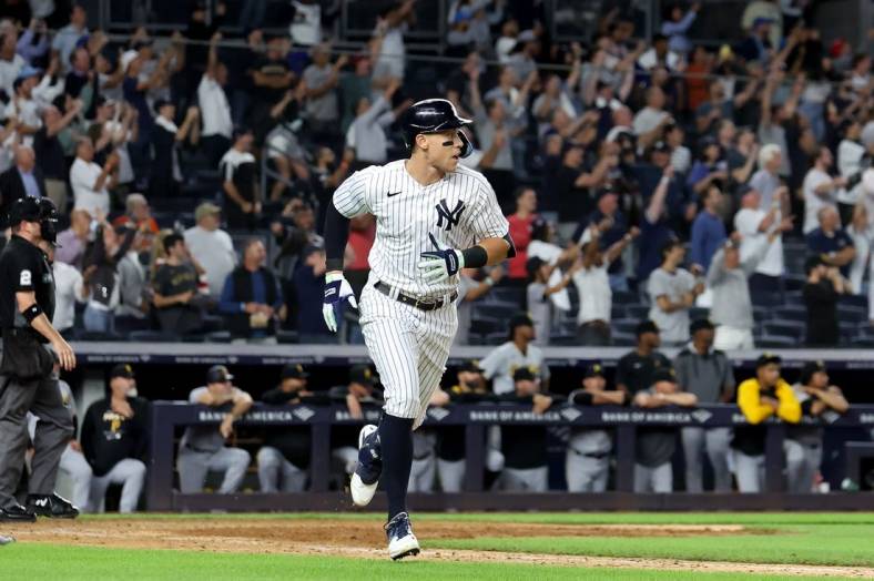Sep 20, 2022; Bronx, New York, USA; New York Yankees right fielder Aaron Judge (99) rounds the bases after hitting a solo home run against the Pittsburgh Pirates during the ninth inning at Yankee Stadium. Mandatory Credit: Brad Penner-USA TODAY Sports