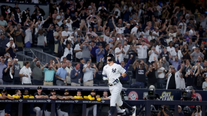 Sep 20, 2022; Bronx, New York, USA; New York Yankees right fielder Aaron Judge (99) rounds the bases after hitting his 60th home run of the season during the ninth inning against the Pittsburgh Pirates at Yankee Stadium. Mandatory Credit: Brad Penner-USA TODAY Sports