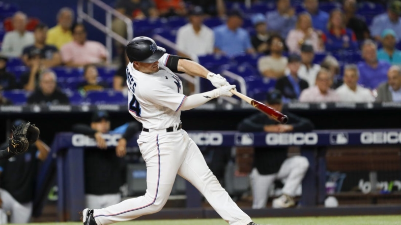 Sep 21, 2022; Miami, Florida, USA; Miami Marlins catcher Nick Fortes (54) hits a two-run home run during the fifth inning against the Chicago Cubs at loanDepot Park. Mandatory Credit: Sam Navarro-USA TODAY Sports
