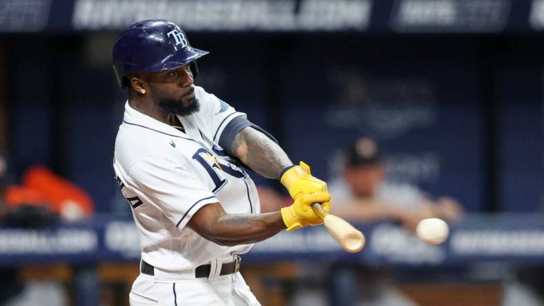 Sep 21, 2022; St. Petersburg, Florida, USA;  Tampa Bay Rays left fielder Randy Arozarena (56) hits a single against the Houston Astros  in the sixth inning at Tropicana Field. Mandatory Credit: Nathan Ray Seebeck-USA TODAY Sports