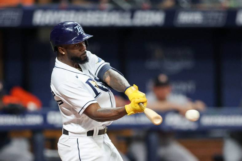 Sep 21, 2022; St. Petersburg, Florida, USA;  Tampa Bay Rays left fielder Randy Arozarena (56) hits a single against the Houston Astros  in the sixth inning at Tropicana Field. Mandatory Credit: Nathan Ray Seebeck-USA TODAY Sports