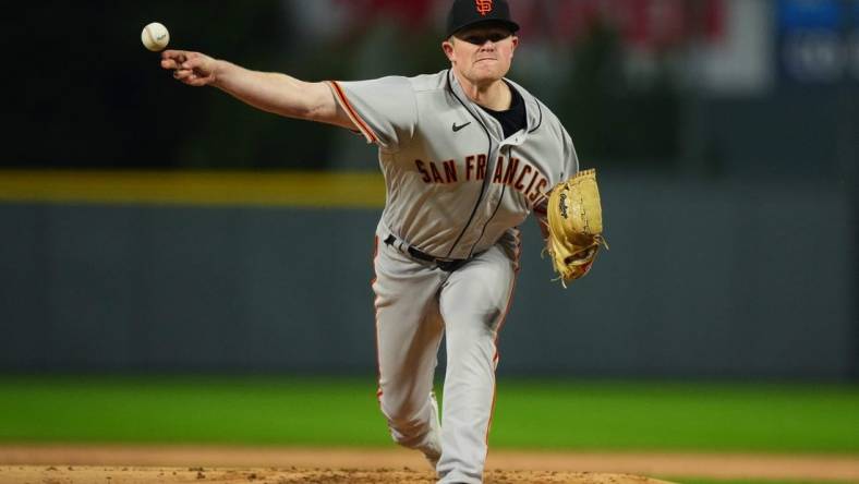 Sep 21, 2022; Denver, Colorado, USA;  San Francisco Giants starting pitcher Logan Webb (62) pitches in the first inning against the Colorado Rockies at Coors Field. Mandatory Credit: Ron Chenoy-USA TODAY Sports