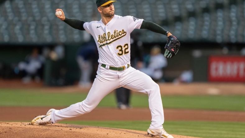 Sep 21, 2022; Oakland, California, USA; Oakland Athletics starting pitcher James Kaprielian (32) pitches during the first inning against the Seattle Mariners at RingCentral Coliseum. Mandatory Credit: Stan Szeto-USA TODAY Sports