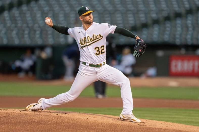 Sep 21, 2022; Oakland, California, USA; Oakland Athletics starting pitcher James Kaprielian (32) pitches during the first inning against the Seattle Mariners at RingCentral Coliseum. Mandatory Credit: Stan Szeto-USA TODAY Sports