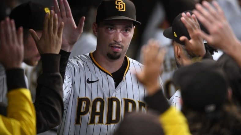 Sep 21, 2022; San Diego, California, USA; San Diego Padres starting pitcher Blake Snell (4) is greeted in the dugout after completing the top of the seventh inning against the St. Louis Cardinals at Petco Park. Mandatory Credit: Orlando Ramirez-USA TODAY Sports
