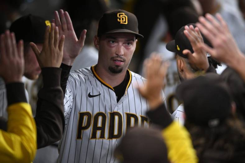 Sep 21, 2022; San Diego, California, USA; San Diego Padres starting pitcher Blake Snell (4) is greeted in the dugout after completing the top of the seventh inning against the St. Louis Cardinals at Petco Park. Mandatory Credit: Orlando Ramirez-USA TODAY Sports