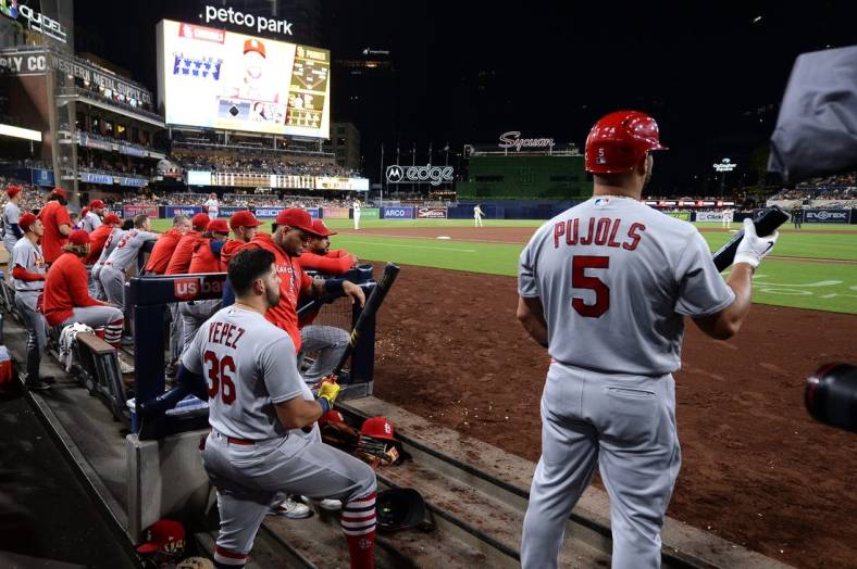 Sep 21, 2022; San Diego, California, USA; St. Louis Cardinals designated hitter Albert Pujols (5) and right fielder Juan Yepez (36) look on from the dugout during the fourth inning against the San Diego Padres at Petco Park. Mandatory Credit: Orlando Ramirez-USA TODAY Sports