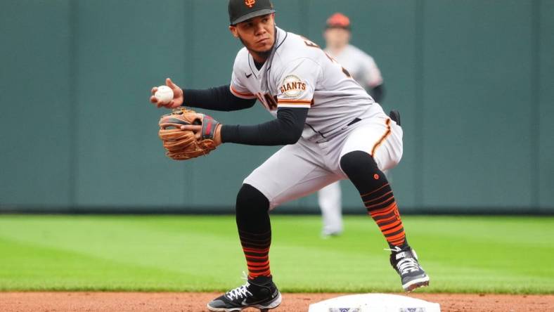 Sep 22, 2022; Denver, Colorado, USA; San Francisco Giants second baseman Thairo Estrada (39) fields the ball in the first inning against the Colorado Rockies at Coors Field. Mandatory Credit: Ron Chenoy-USA TODAY Sports