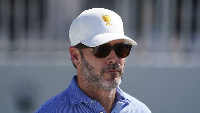 Sep 22, 2022; Charlotte, North Carolina, USA; Race car driver Jimmie Johnson stands on the eighth tee during the foursomes match play of the Presidents Cup golf tournament at Quail Hollow Club. Mandatory Credit: Peter Casey-USA TODAY Sports