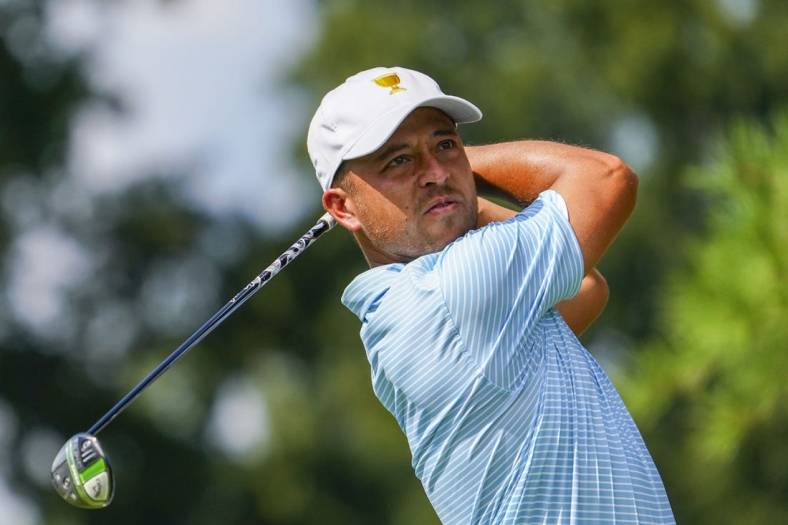 Sep 22, 2022; Charlotte, North Carolina, USA; Team USA golfer Xander Schauffele hits his tee shot on the eighth tee during the foursomes match play of the Presidents Cup golf tournament at Quail Hollow Club. Mandatory Credit: Peter Casey-USA TODAY Sports