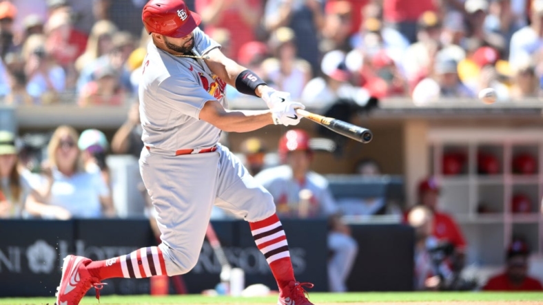 Sep 22, 2022; San Diego, California, USA; St. Louis Cardinals designated hitter Albert Pujols (5) hits a single against the San Diego Padres during the second inning at Petco Park. Mandatory Credit: Orlando Ramirez-USA TODAY Sports
