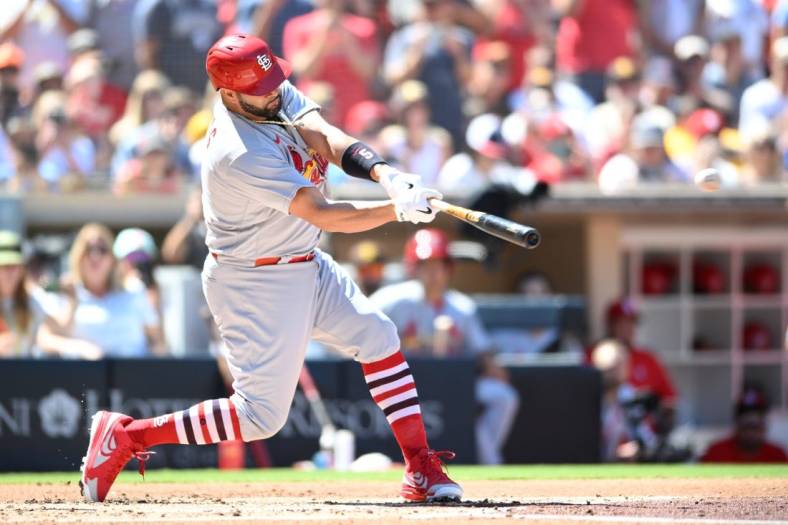 Sep 22, 2022; San Diego, California, USA; St. Louis Cardinals designated hitter Albert Pujols (5) hits a single against the San Diego Padres during the second inning at Petco Park. Mandatory Credit: Orlando Ramirez-USA TODAY Sports