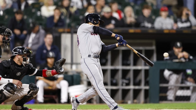 Sep 22, 2022; Chicago, Illinois, USA; Cleveland Guardians left fielder Steven Kwan (38) hits an RBI triple against the Chicago White Sox during the fifth inning at Guaranteed Rate Field. Mandatory Credit: Kamil Krzaczynski-USA TODAY Sports