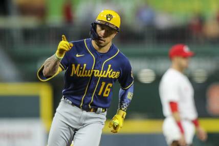 Sep 22, 2022; Cincinnati, Ohio, USA; Milwaukee Brewers second baseman Kolten Wong (16) reacts after hitting a two-run home run in the sixth inning against the Cincinnati Reds at Great American Ball Park. Mandatory Credit: Katie Stratman-USA TODAY Sports