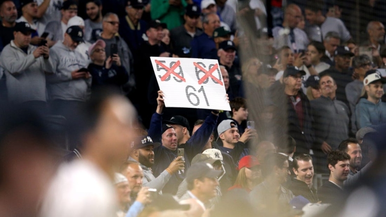 Sep 22, 2022; Bronx, New York, USA; A fan holds a sign as New York Yankees right fielder Aaron Judge (not pictured) bats against the Boston Red Sox during the ninth inning at Yankee Stadium. Mandatory Credit: Brad Penner-USA TODAY Sports