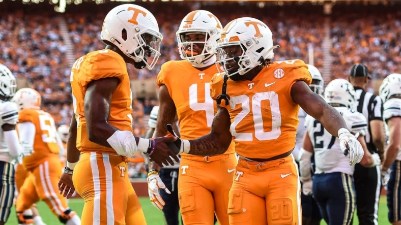Sep 17, 2022; Knoxville, Tennessee, USA; Tennessee Volunteers running back Jaylen Wright (20) and quarterback Hendon Hooker (5) celebrate after a touchdown during the first half against the Akron Zips at Neyland Stadium. Mandatory Credit: Bryan Lynn-USA TODAY Sports