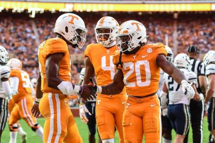 Sep 17, 2022; Knoxville, Tennessee, USA; Tennessee Volunteers running back Jaylen Wright (20) and quarterback Hendon Hooker (5) celebrate after a touchdown during the first half against the Akron Zips at Neyland Stadium. Mandatory Credit: Bryan Lynn-USA TODAY Sports