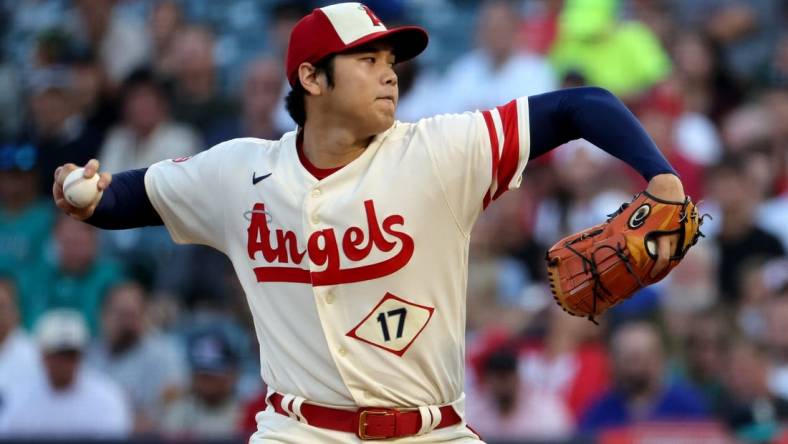 Sep 17, 2022; Anaheim, California, USA;  Los Angeles Angels two-way player Shohei Ohtani (17) pitches during the first inning against the Seattle Mariners at Angel Stadium. Mandatory Credit: Kiyoshi Mio-USA TODAY Sports