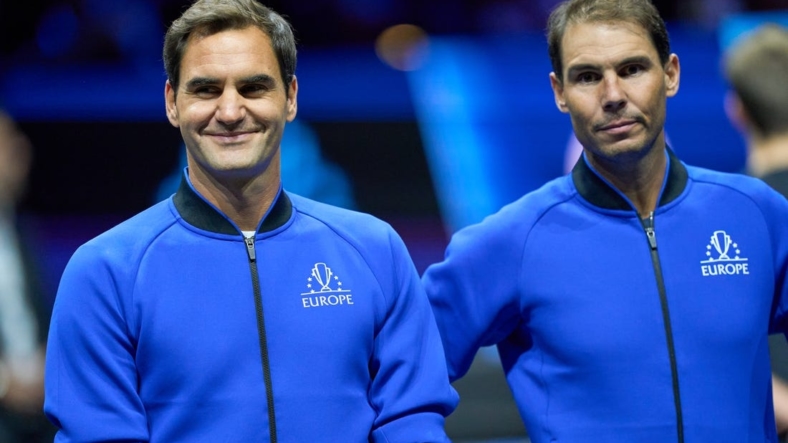 Sep 23, 2022; London, United Kingdom;  Roger Federer (SUI) and Rafael Nadal (ESP) of Team Europe  on court at the opening of the Laver Cup tennis event.  Mandatory Credit: Peter van den Berg-USA TODAY Sports