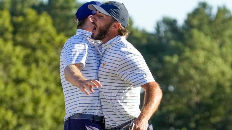 Sep 23, 2022; Charlotte, North Carolina, USA; Team USA golfer Max Homa celebrates on the 18th green during the four-ball match play of the Presidents Cup golf tournament at Quail Hollow Club. Mandatory Credit: Jim Dedmon-USA TODAY Sports