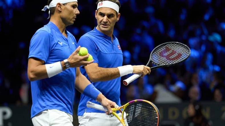 Sep 23, 2022; London, United Kingdom;  Roger Federer (SUI) and doubles partner Rafael Nadal (ESP) react while playing against Jack Sock (USA) and Frances Tiafoe in a Laver Cup tennis match.  Mandatory Credit: Peter van den Berg-USA TODAY Sports