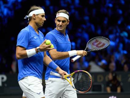 Sep 23, 2022; London, United Kingdom;  Roger Federer (SUI) and doubles partner Rafael Nadal (ESP) react while playing against Jack Sock (USA) and Frances Tiafoe in a Laver Cup tennis match.  Mandatory Credit: Peter van den Berg-USA TODAY Sports